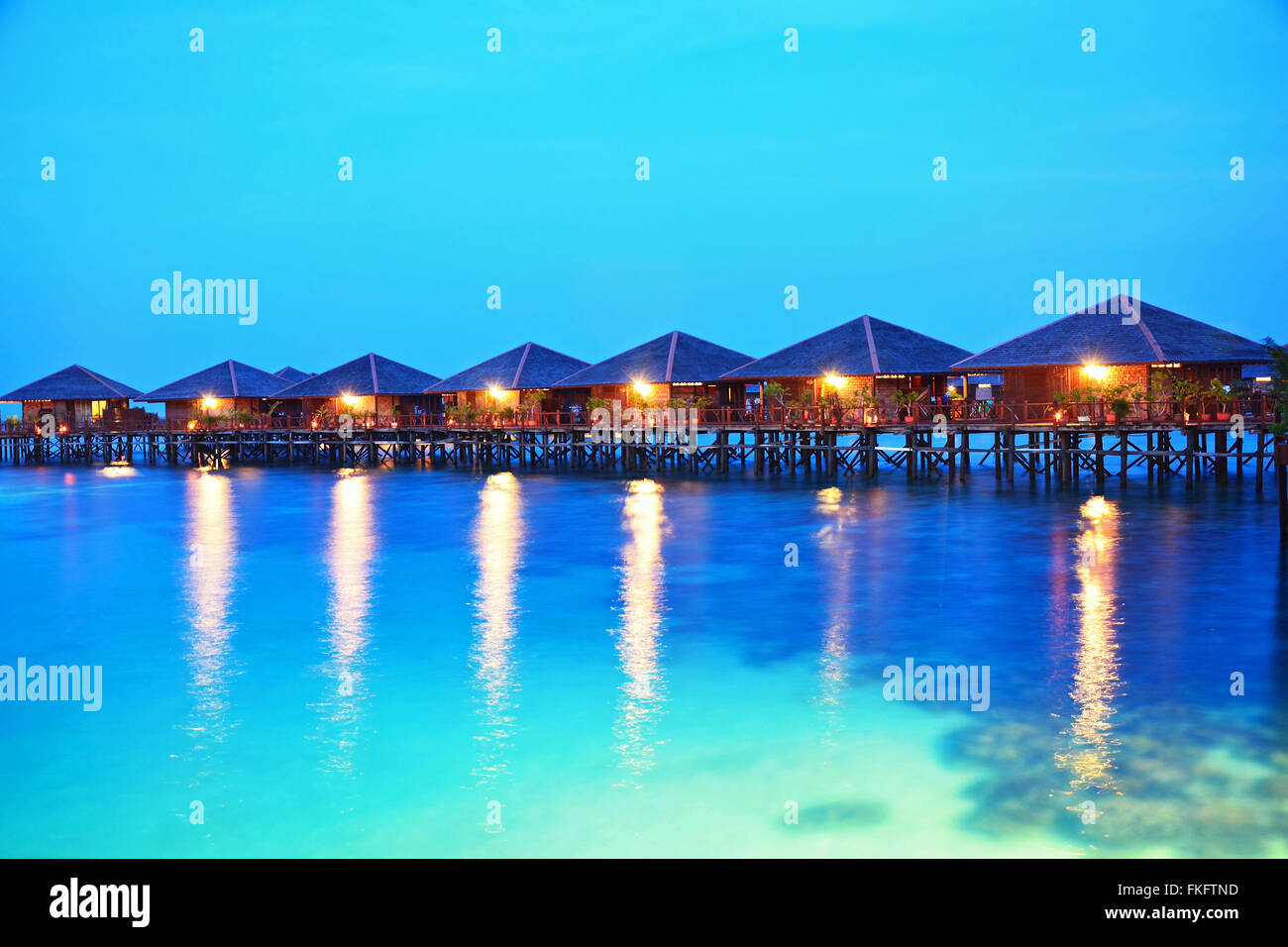 Twilight scene Living in the ocean at Mabul island, Malaysia Stock Photo