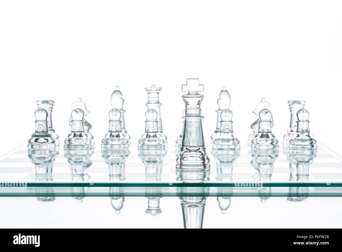 leader Standing Out From The Crowd, glass Chess Studio Shot Stock Photo