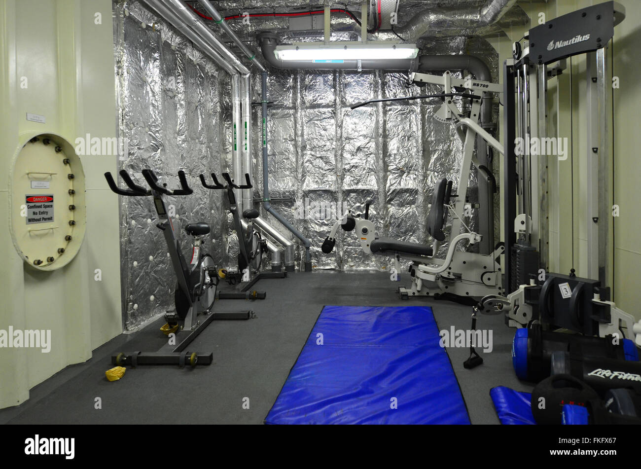 Gym room on a Naval ship.Us Navy physical fitness test consists 1.5