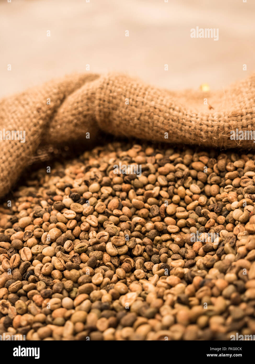green unroasted coffee beans in sack Stock Photo Alamy
