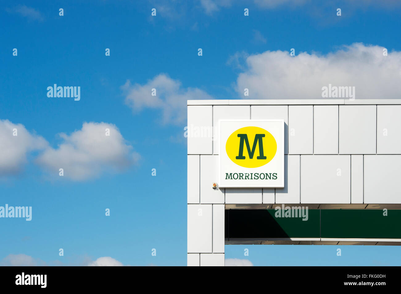 Morrisons supermarket sign against a blue cloudy sky Stock Photo