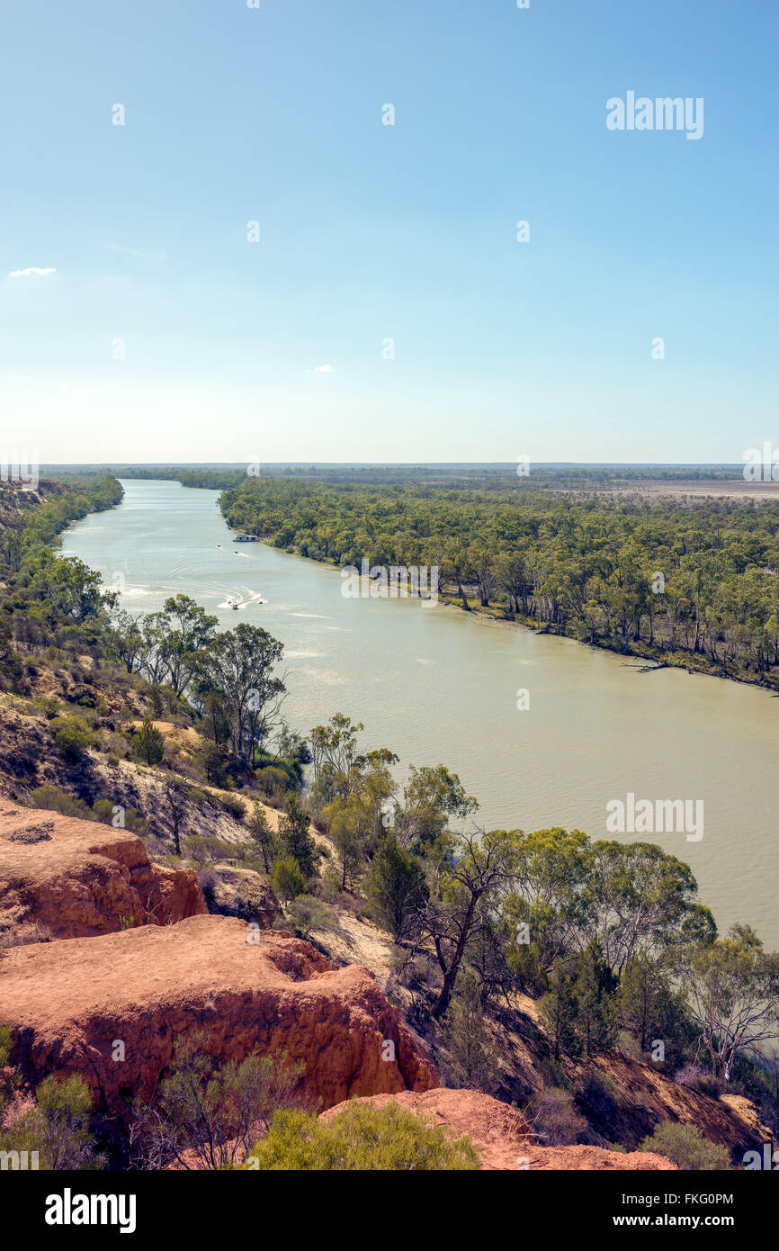 A clifftop view of water ski enthusiasts and houseboat holiday makers