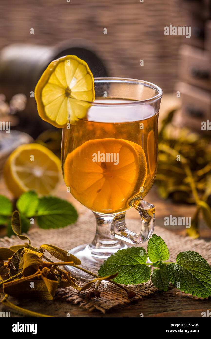 Cup of fresh herbal tea on rustic background Stock Photo - Alamy