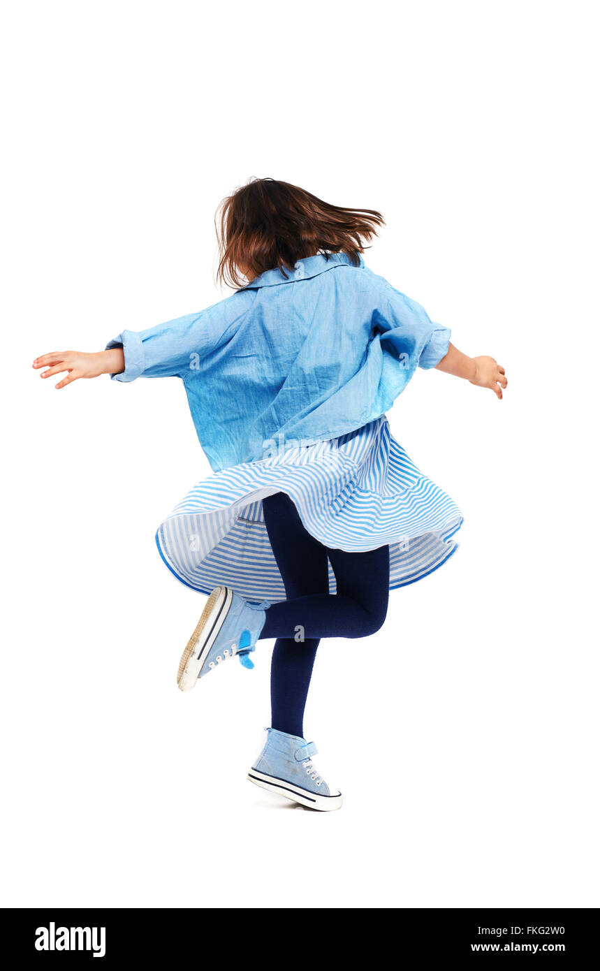Rear view of little casual girl dancing Stock Photo - Alamy