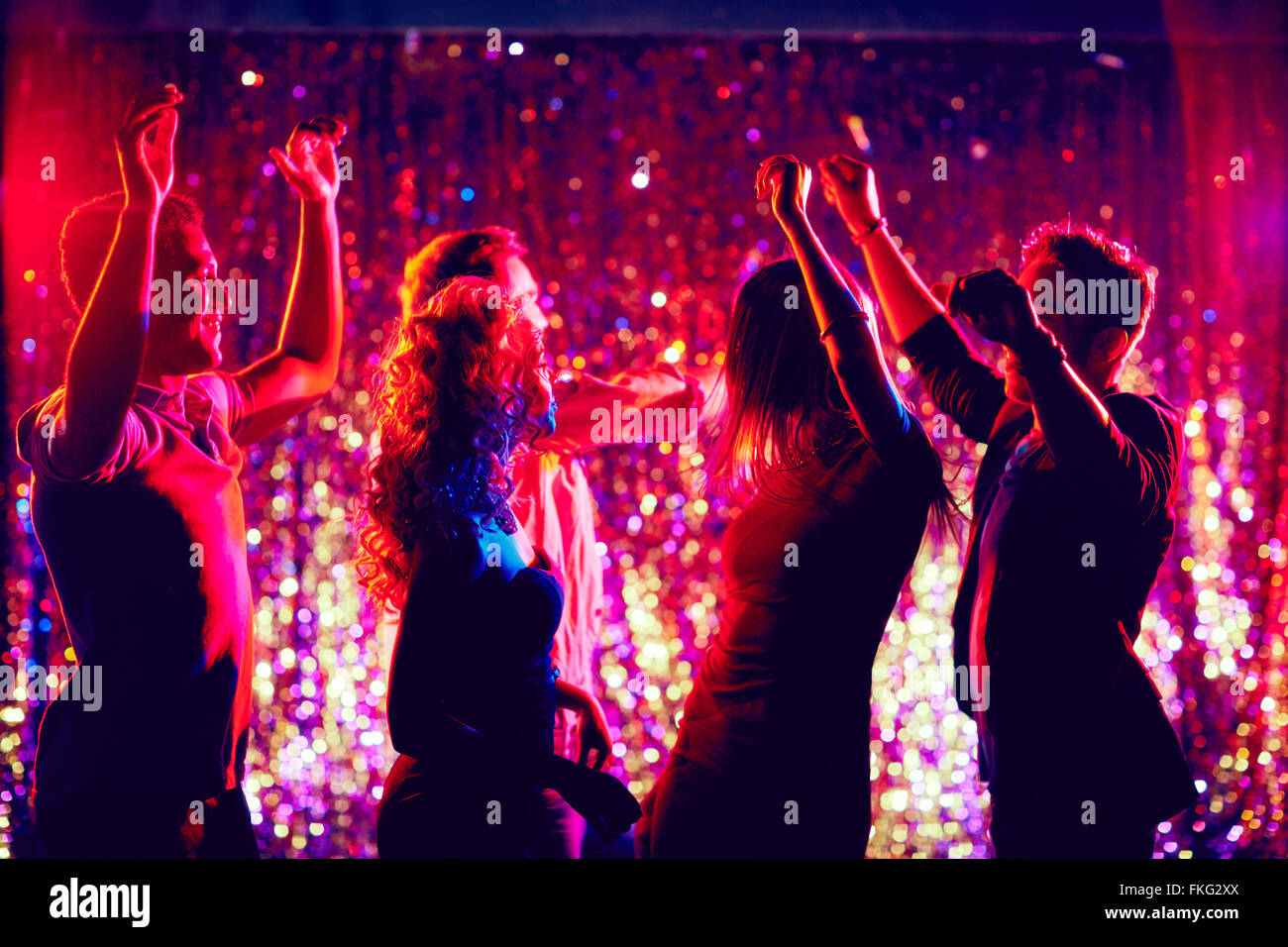 Group of people dancing in disco club to the music Stock Photo
