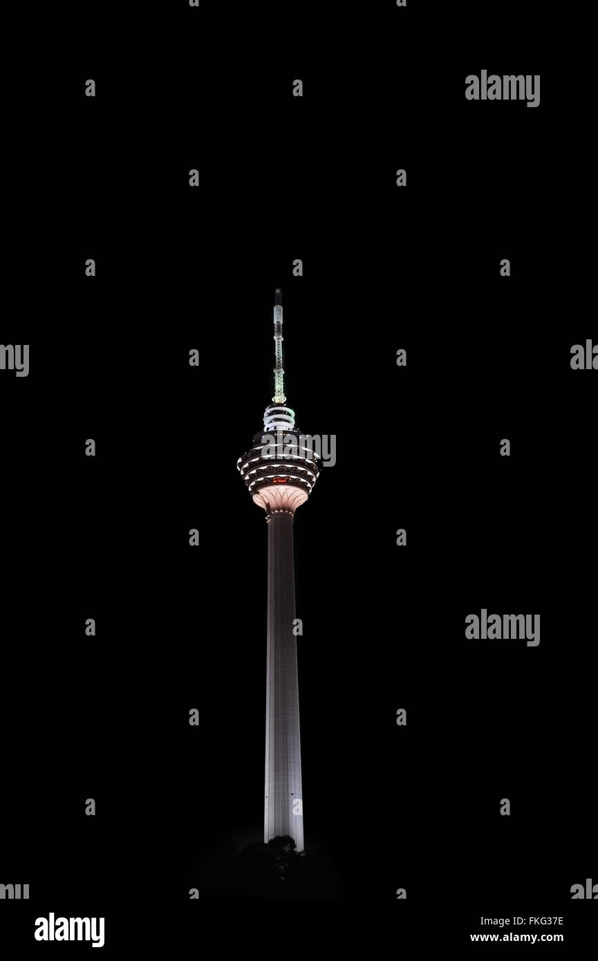 View of Kuala Lumpur TV Tower at night on a black background. Malaysia Stock Photo