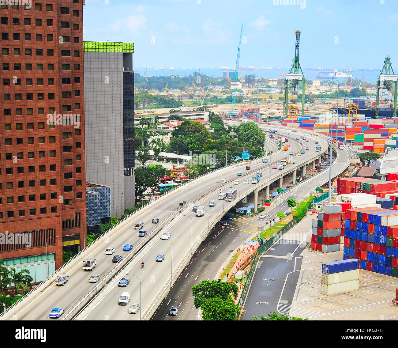 Modern highway and commercial port with many containers in Singapore Stock Photo