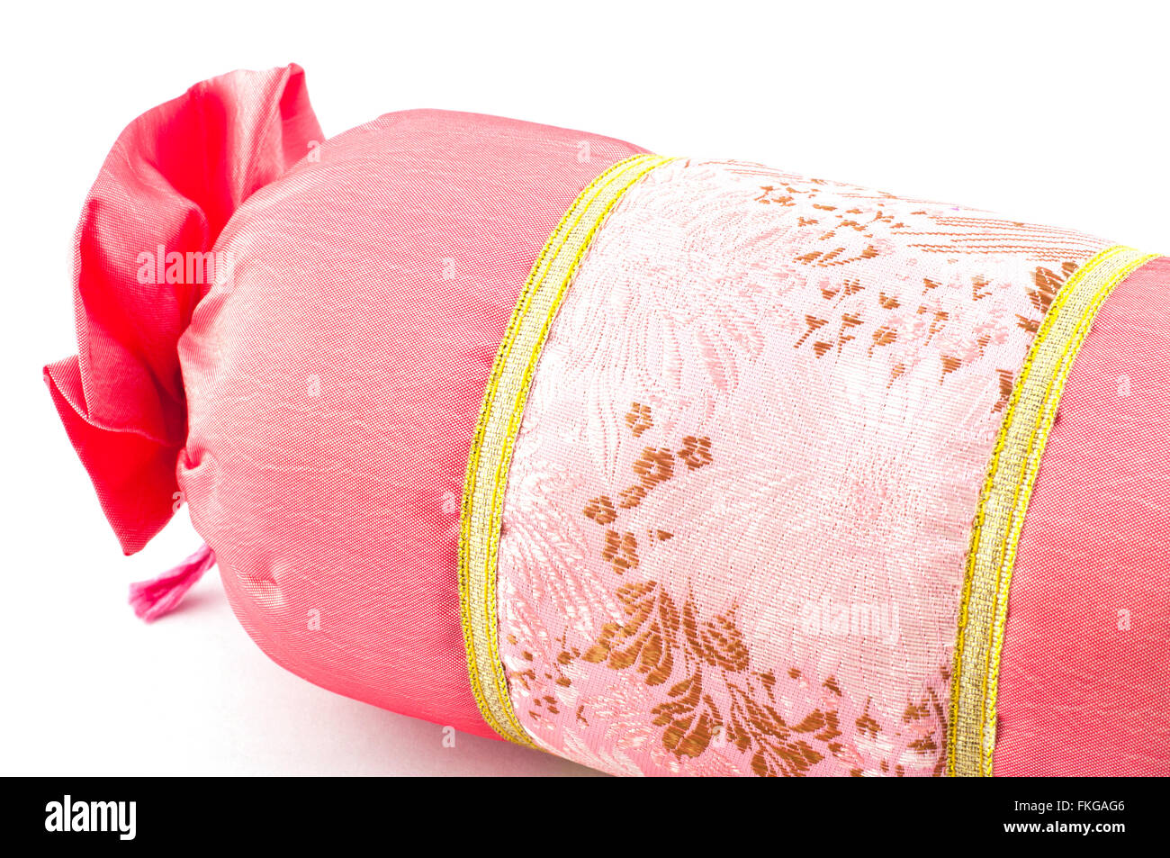 Pink mini roller pillow isolated on white background. Stock Photo