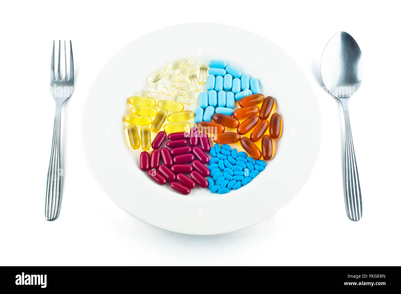 Pills in dish replace food concept isolated on white background Stock