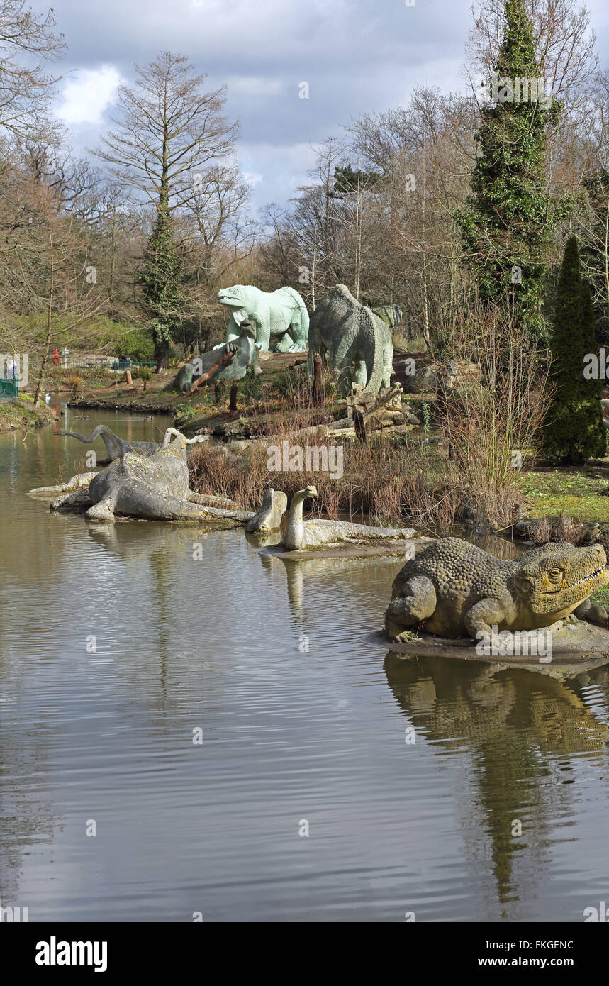 Life-size dinosaur statues in Crystal Palace Park, London. Erected as part of the Great Exhibition in 1854 Stock Photo