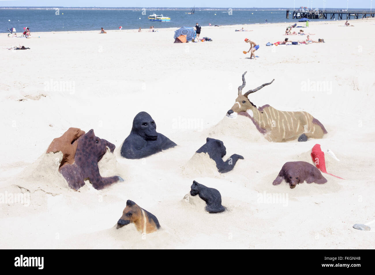 Group of African animal sand sculptures, Arcachon beach South-west France Stock Photo