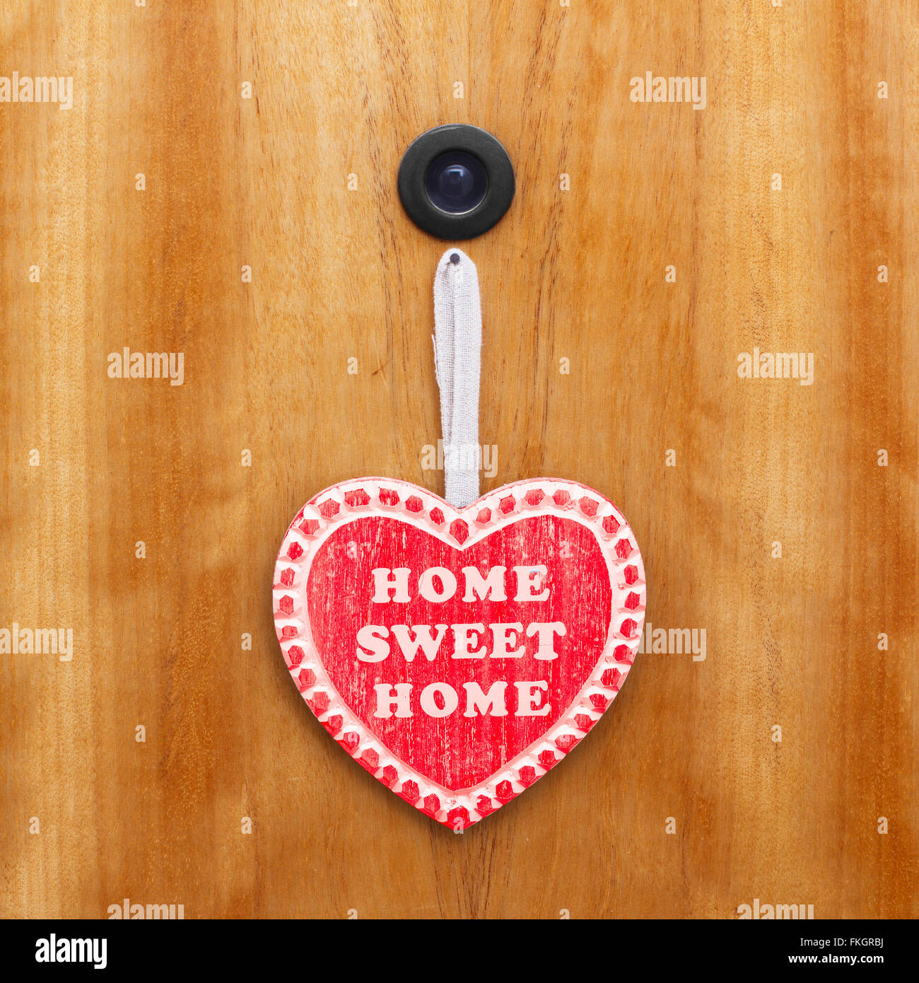 Home sweet home heart on door Stock Photo