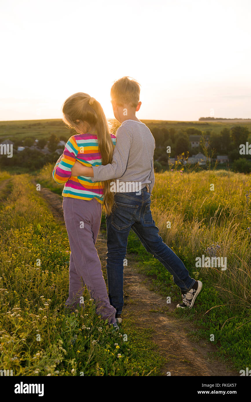 Boy and girl holding hands hi-res stock photography and images - Alamy, image size:867x1390