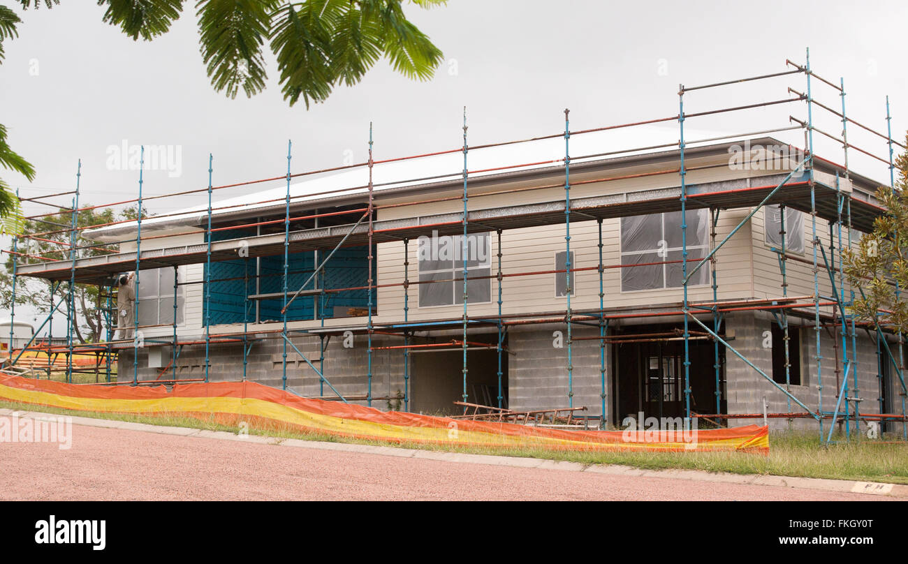 Two story new modern house construction with scaffolding Stock Photo