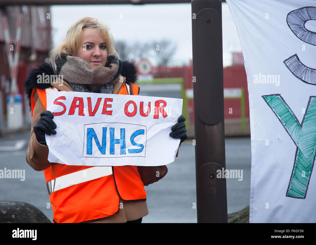 Southport, Merseyside, UK 9th March, 2016.  Tracey Smith and others, who have completed a 13 hours shift at the Southport and Formby District General Hospital, Town Lane, Kew, protest against the imposition of new junior doctors contracts.  The third strike by junior doctors in their contract row with the government in England is under way.  The action began at 08:00 GMT is scheduled to last 48 hours - the longest one so far - but medics are once again providing emergency cover in hospitals. Stock Photo