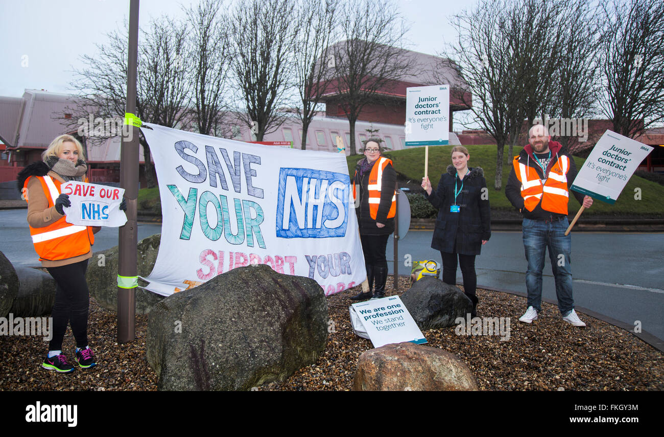 Southport, Merseyside, UK 9th March, 2016.  Tracey Smith and others, who have completed a 13 hours shift at the Southport and Formby District General Hospital, Town Lane, Kew, protest against the imposition of new junior doctors contracts.  The third strike by junior doctors in their contract row with the government in England is under way.  The action began at 08:00 GMT is scheduled to last 48 hours - the longest one so far - but medics & medical staff are once again providing emergency cover in hospitals. Stock Photo