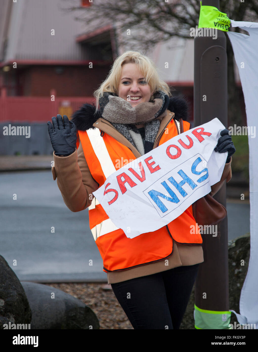 Southport, Merseyside, UK 9th March, 2016.  Tracey Smith and others, who have completed a 13 hours shift at the Southport and Formby District General Hospital, Town Lane, Kew, protest against the imposition of new junior doctors contracts.  The third strike by junior doctors in their contract row with the government in England is under way.  The action began at 08:00 GMT is scheduled to last 48 hours - the longest one so far - but medics are once again providing emergency cover in hospitals. Stock Photo