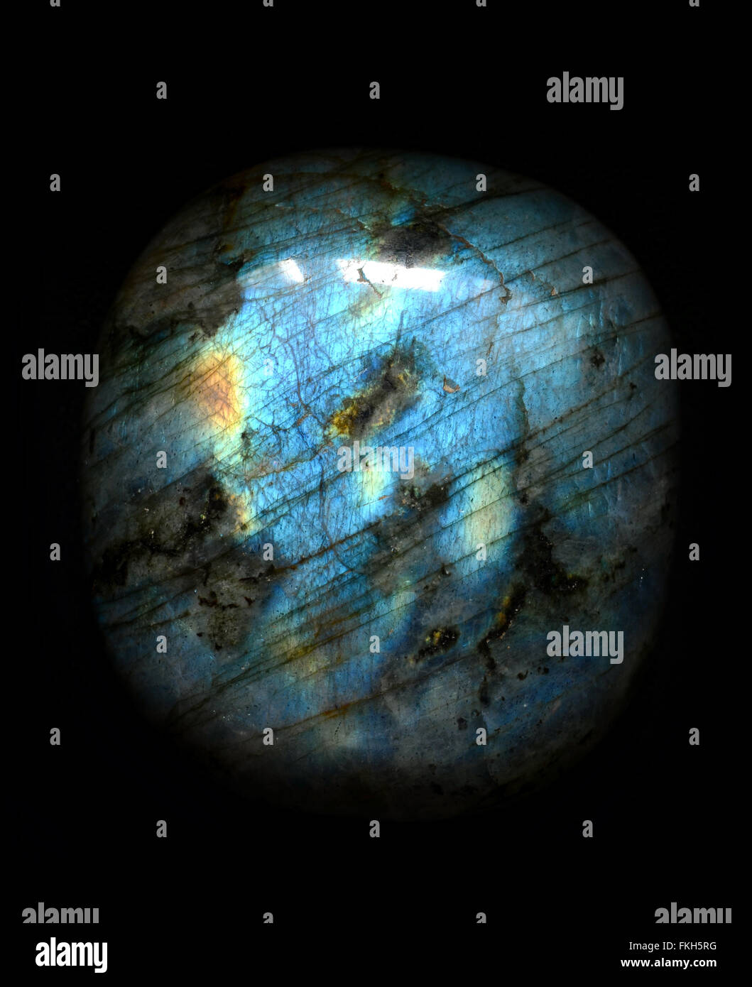 Polished blue labradorite isolated on black background Stock Photo - Alamy