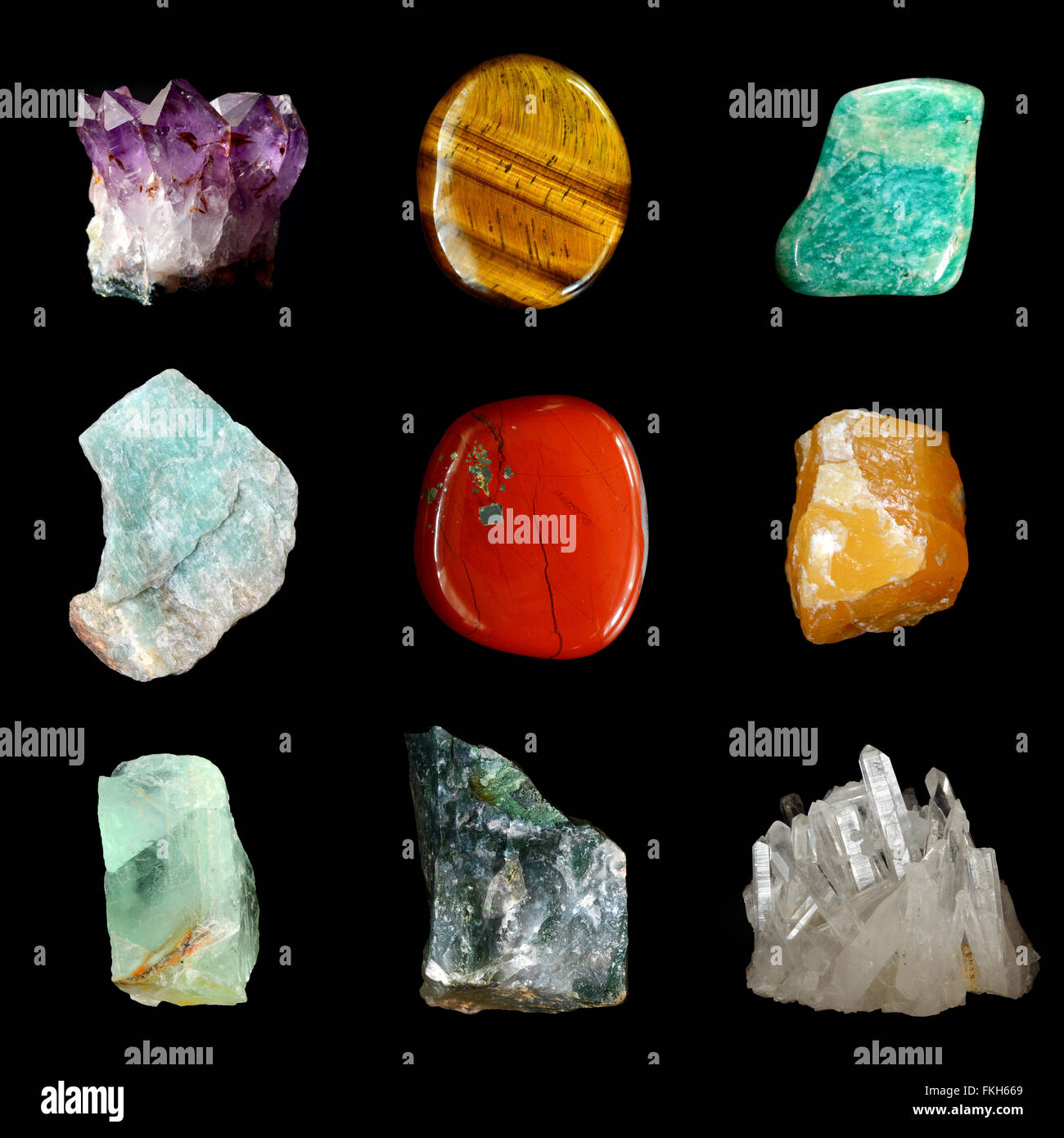 Set of various mineral rocks and stones,  Amethyst, Tiger Eye, Amazonite, Raw Amazonite,  Red Jasper, Yellow calcite, Green Fluo Stock Photo