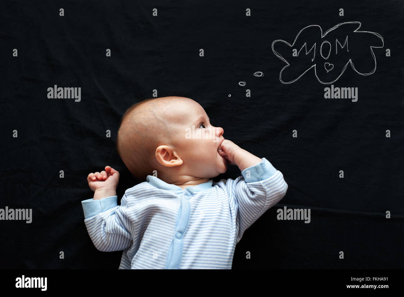 Baby newborn thinking about his mother Stock Photo