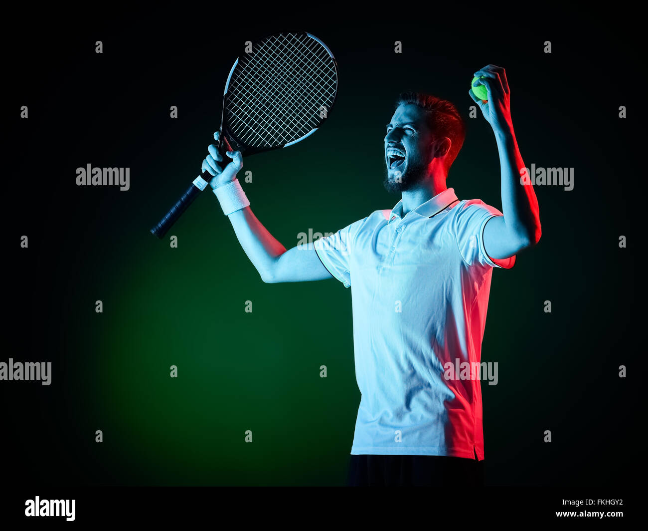 one caucasian tennis player man studio isolated on black background Stock Photo