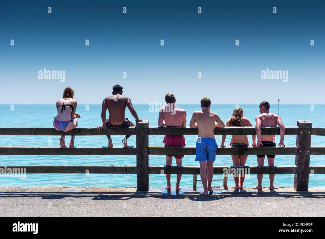 Teenage boys and girls at the seafront, Broadstairs, Kent, UK Stock Photo