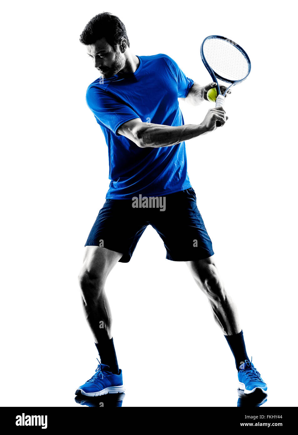 one caucasian man playing tennis player in studio silhouette isolated on white background Stock Photo