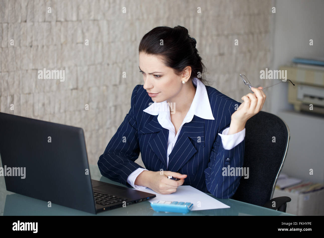 Accountant surprised on bad financial balance in office Stock Photo