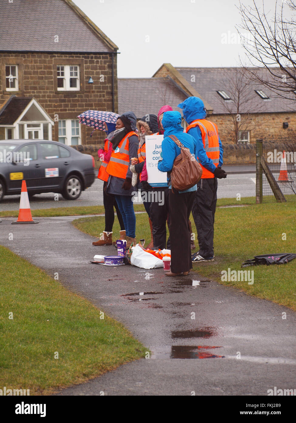 Newcastle Upon Tyne, UK. 9th March 2016. UK News: Junior doctors walk out in the pouring rain on a 48 hour strike outside Rake Lane Hospital in North Tyneside. Credit:  james walsh/Alamy Live News Stock Photo