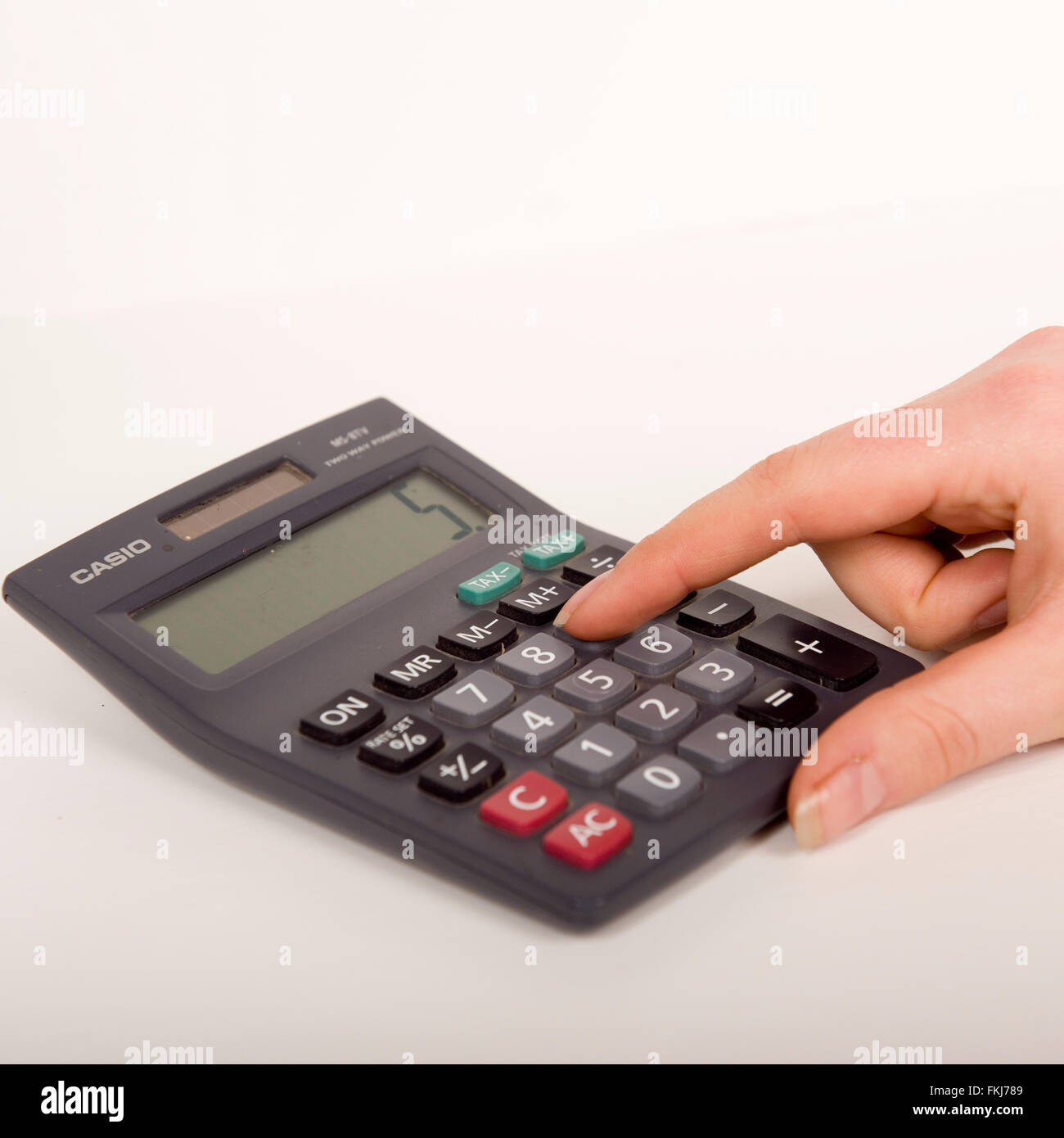 female using a calculator Stock Photo