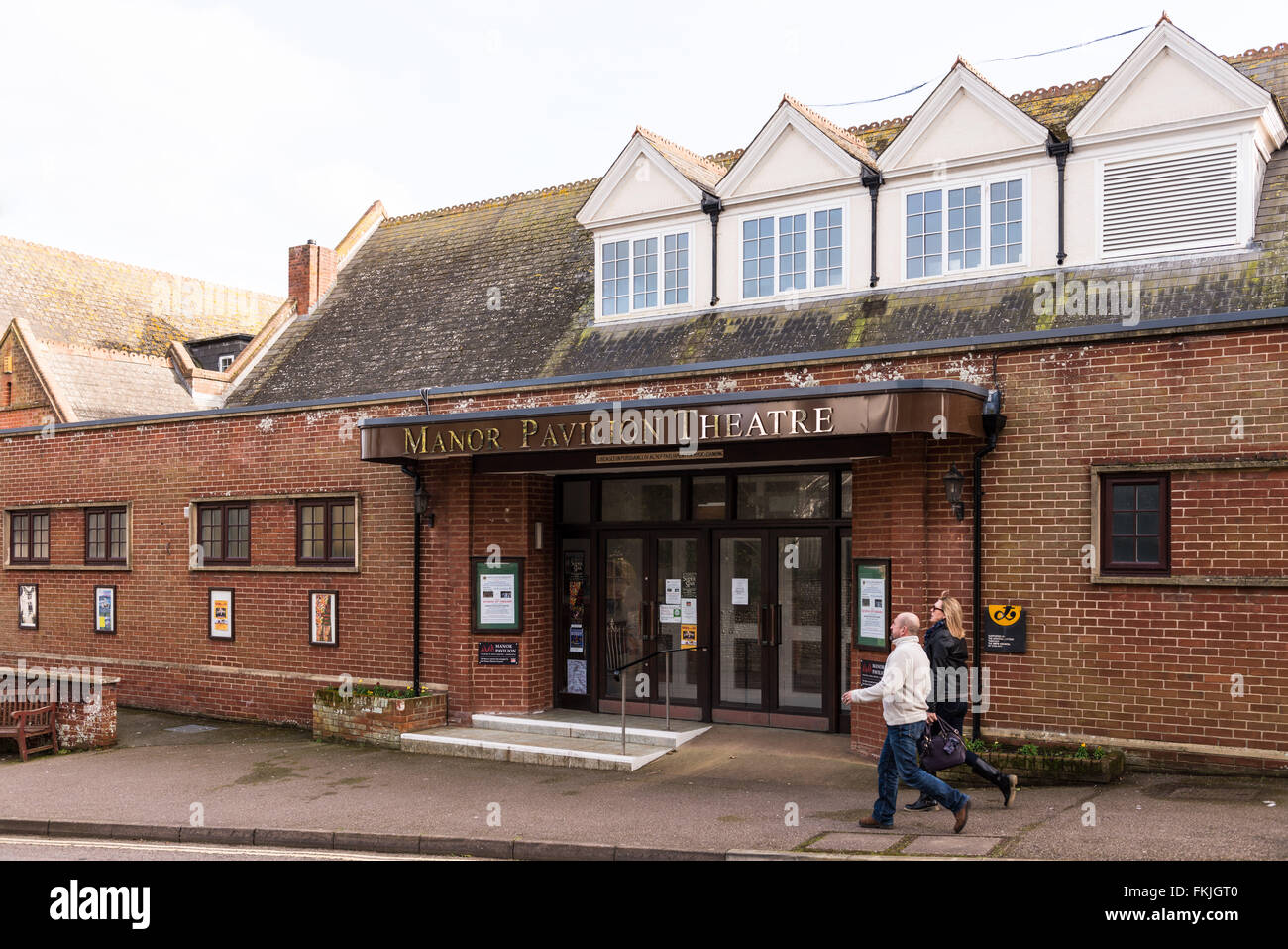 Sidmouth Manor Pavilion Theatre with a male and female walking by Stock