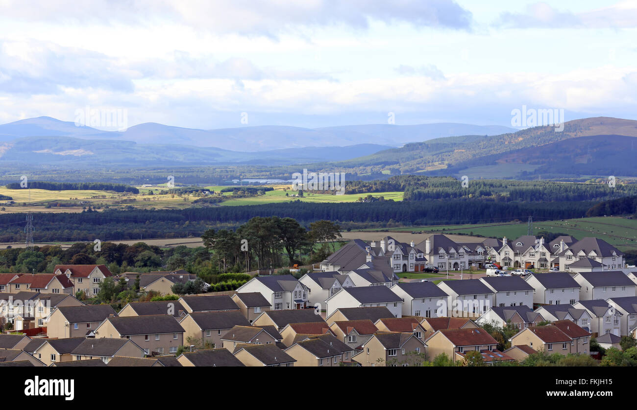 Skyline of the suburb of Westhill just outside the city of Aberdeen in Scotland, UK, with mountains in the background Stock Photo