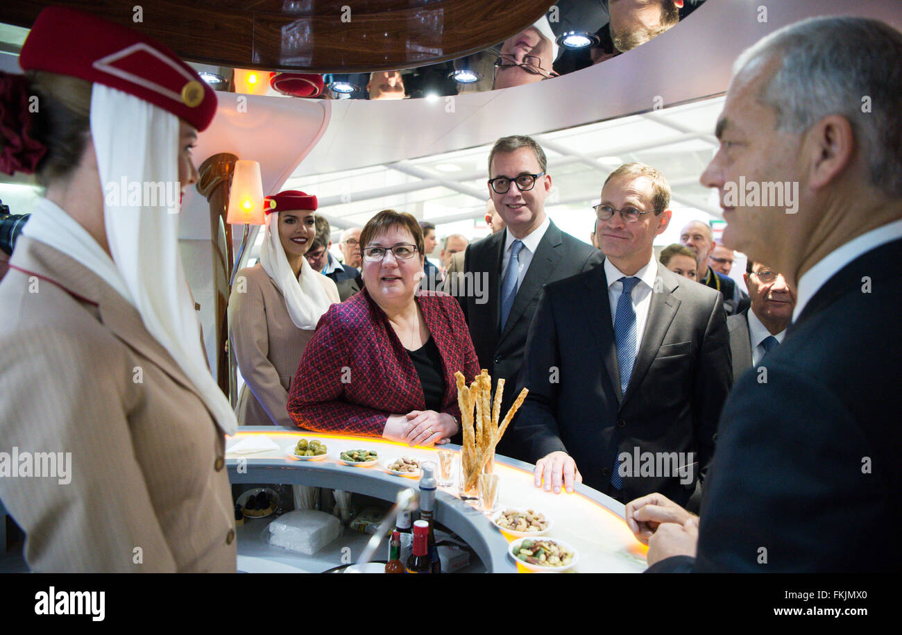 Berlin, Germany. 09th Mar, 2016. Mayor of Berlin Michael Mueller (2.f.R) and Iris Gleicke (3.f.L), parliamentary state secretary at the Minsitry of the Environment, speak with head of sales Thierry Antinori (R) at the Emirates airline stand during an opening tour at the ITB international travel trade show in Berlin, Germany, 09 March 2016. Around 10,000 exhibitors from more than 180 countries are presenting their new offers in the travel industry from 09 until 13 March 2016. Credit:  dpa picture alliance/Alamy Live News Stock Photo