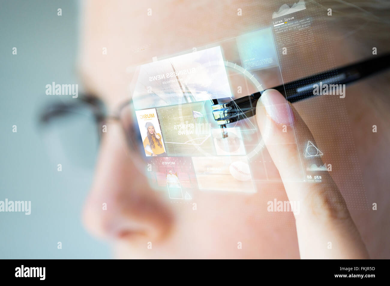close up of woman in glasses with virtual screen Stock Photo