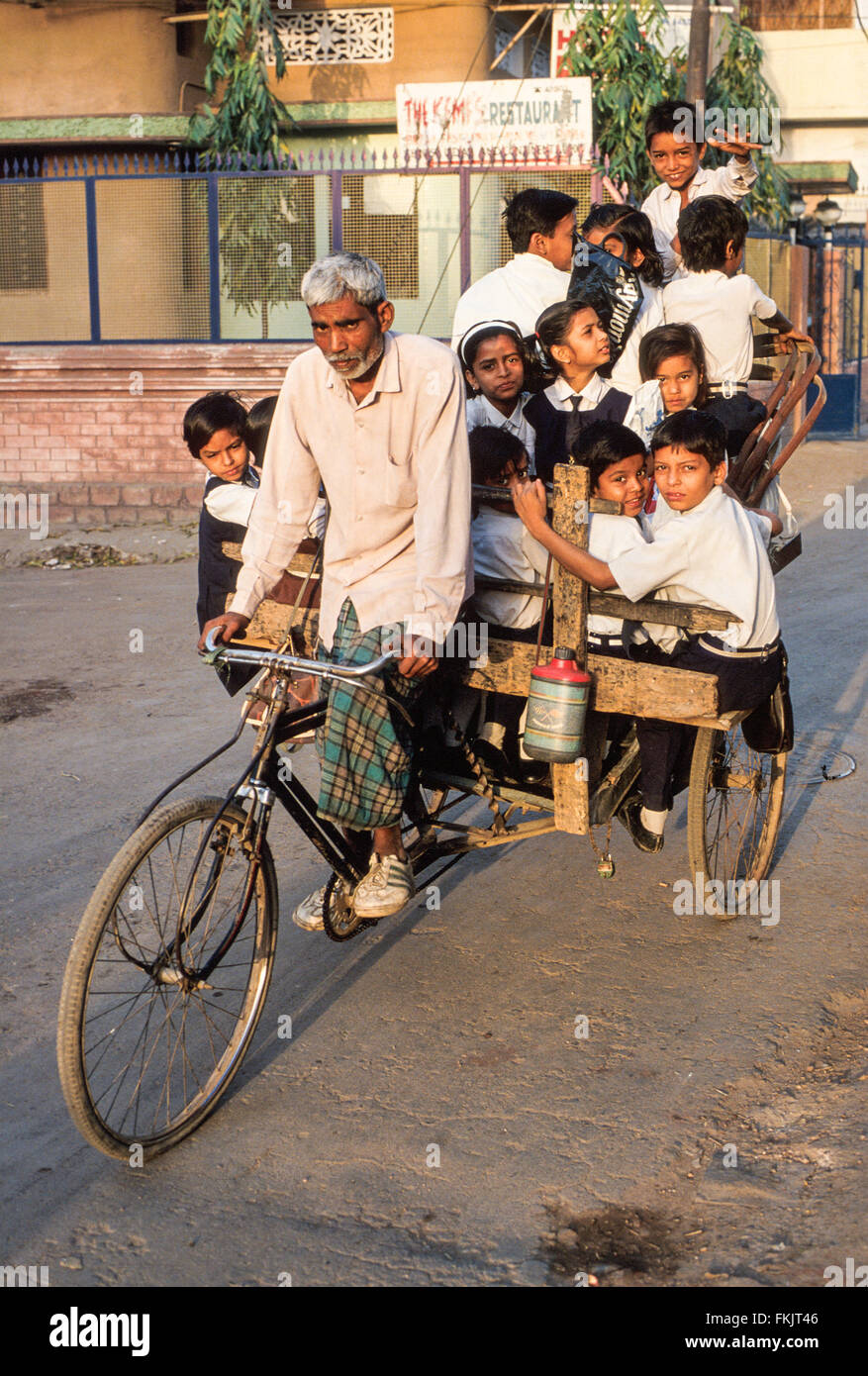 Bicycle rickshaw, rider ,driver,taxi, with his morning fare of large ...