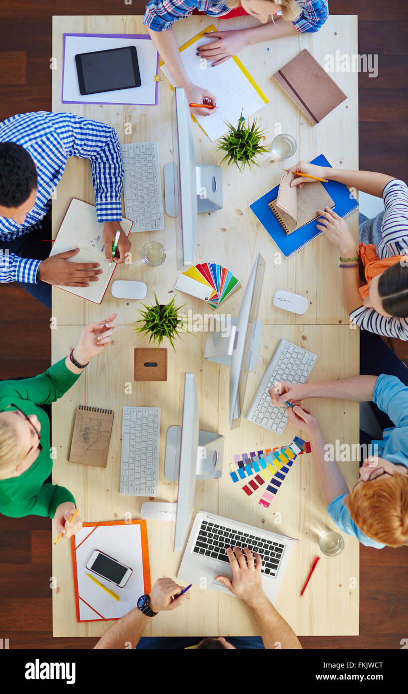 Group of designers working together at the table at office Stock Photo ...