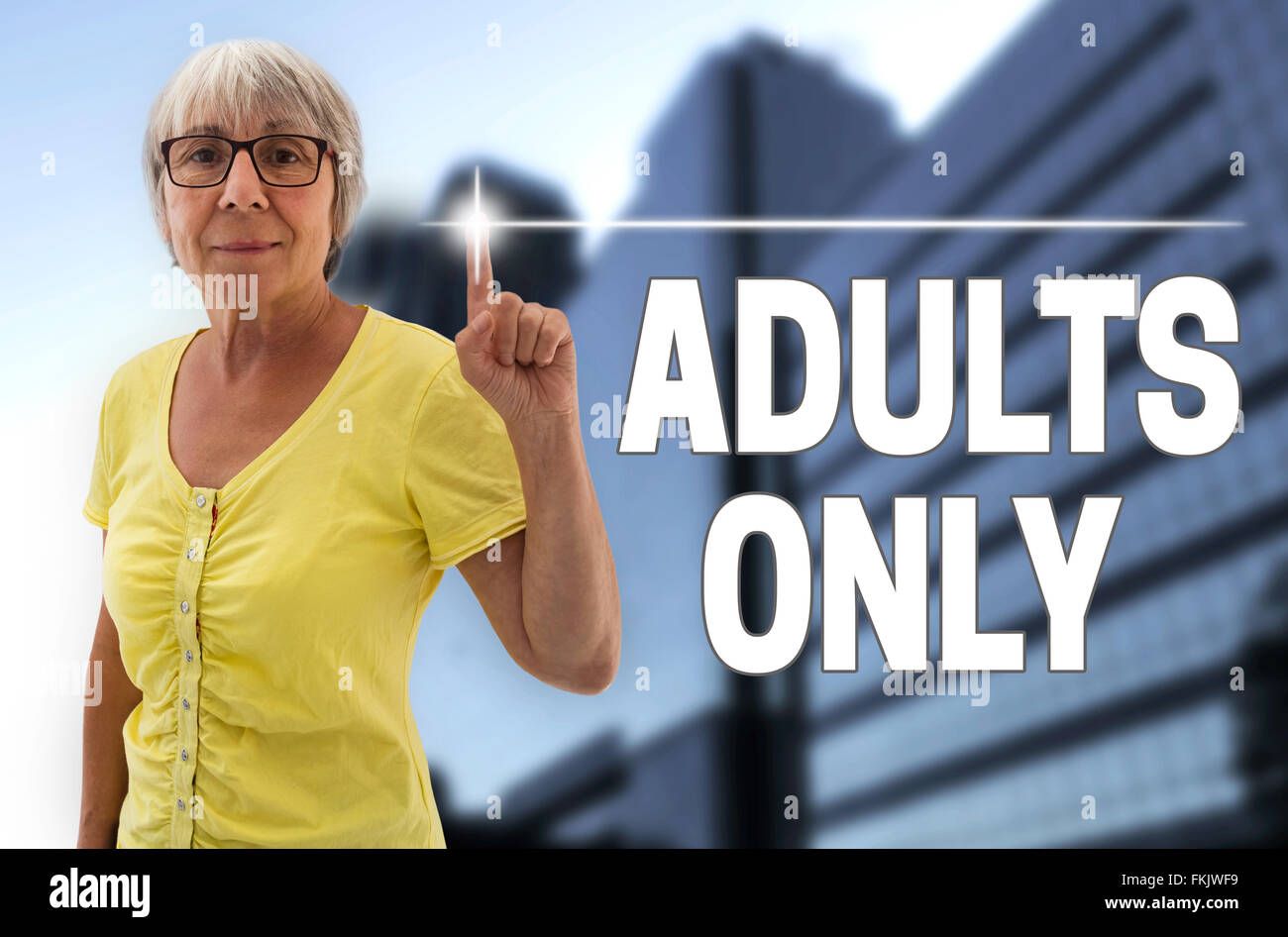 adults only touchscreen is shown by senior. Stock Photo