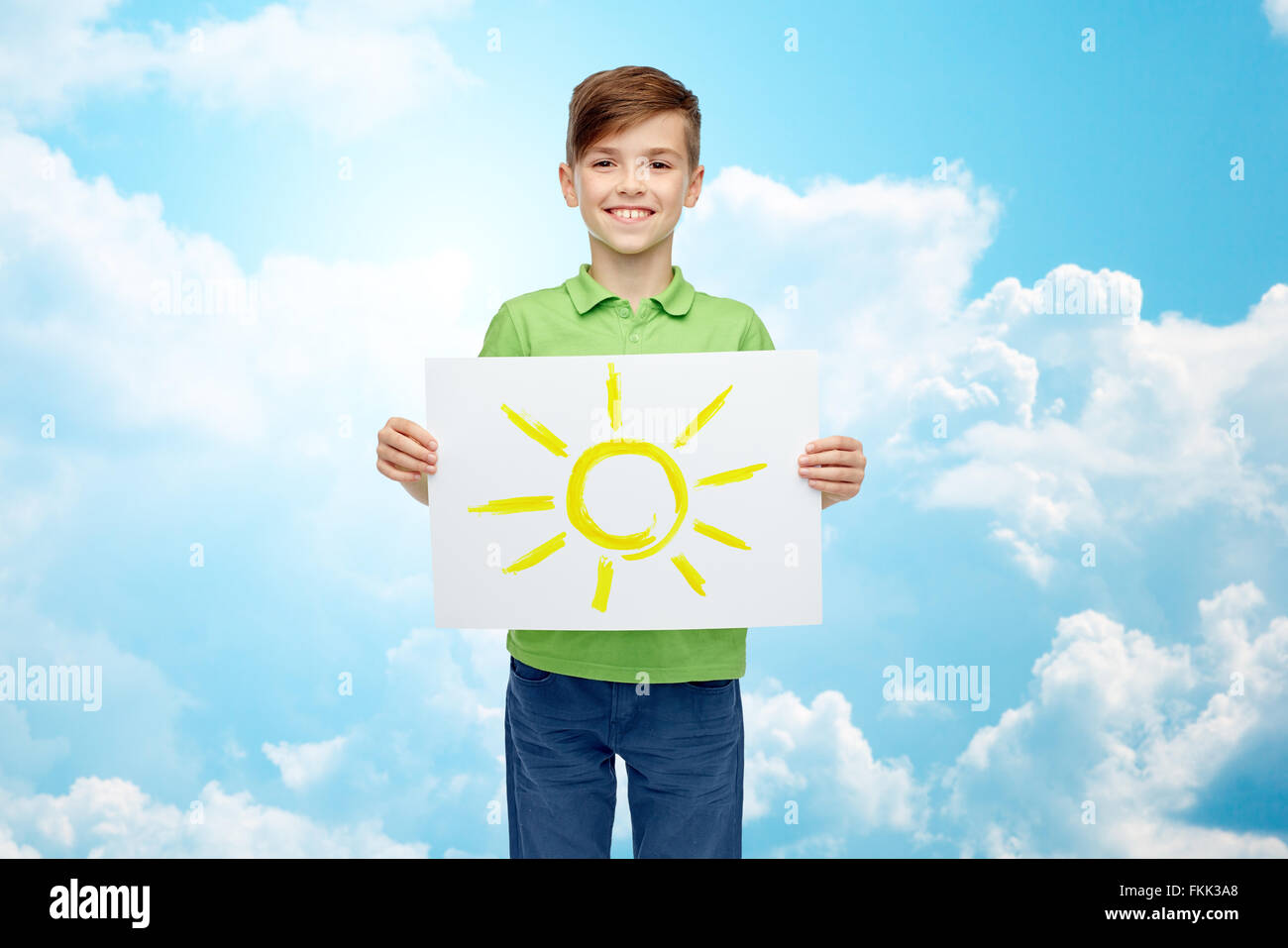 happy boy holding drawing or picture of sun Stock Photo - Alamy