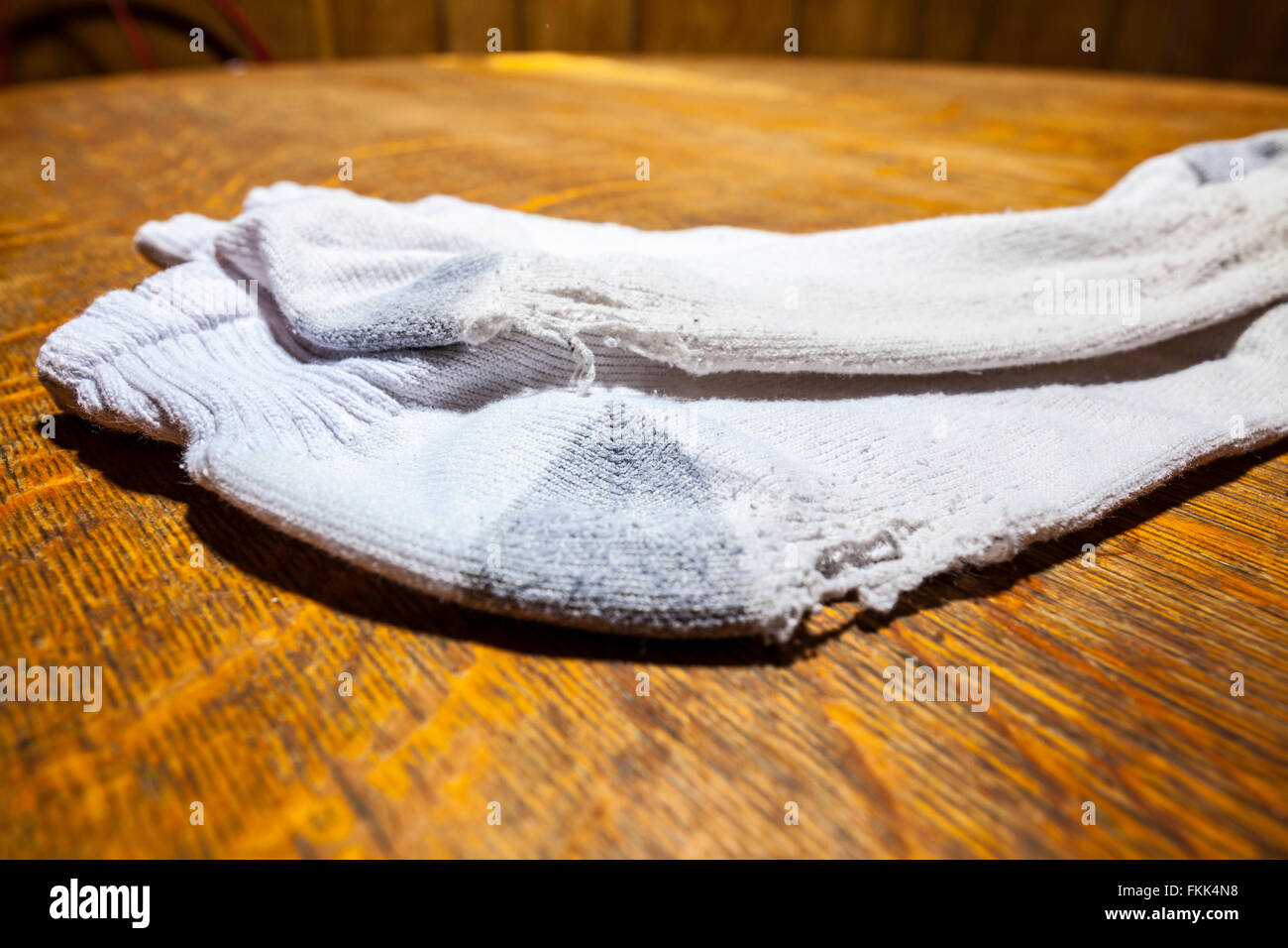 A pair of old socks with holes in them Stock Photo Alamy