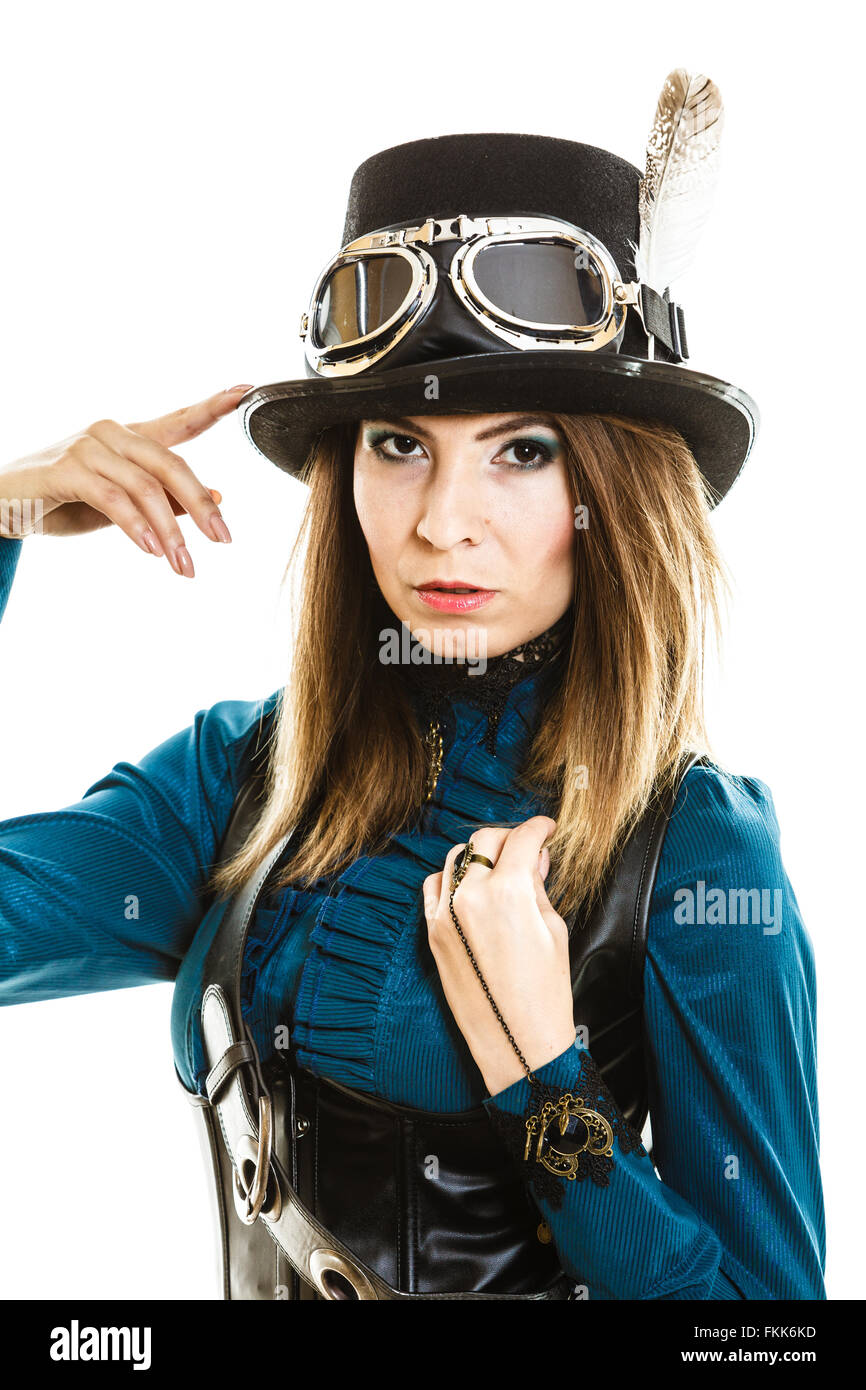 Young steampunk isolated girl on white touching fancy hat. Fantasy old