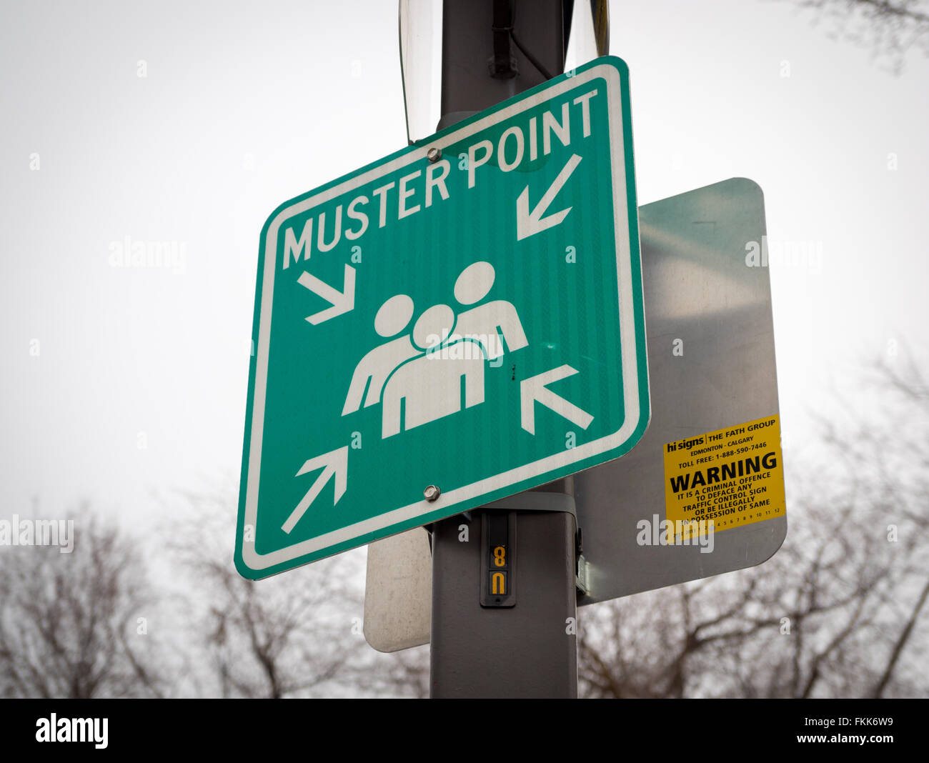 A sign depicting a muster point (meeting point).  Edmonton, Alberta, Canada. Stock Photo