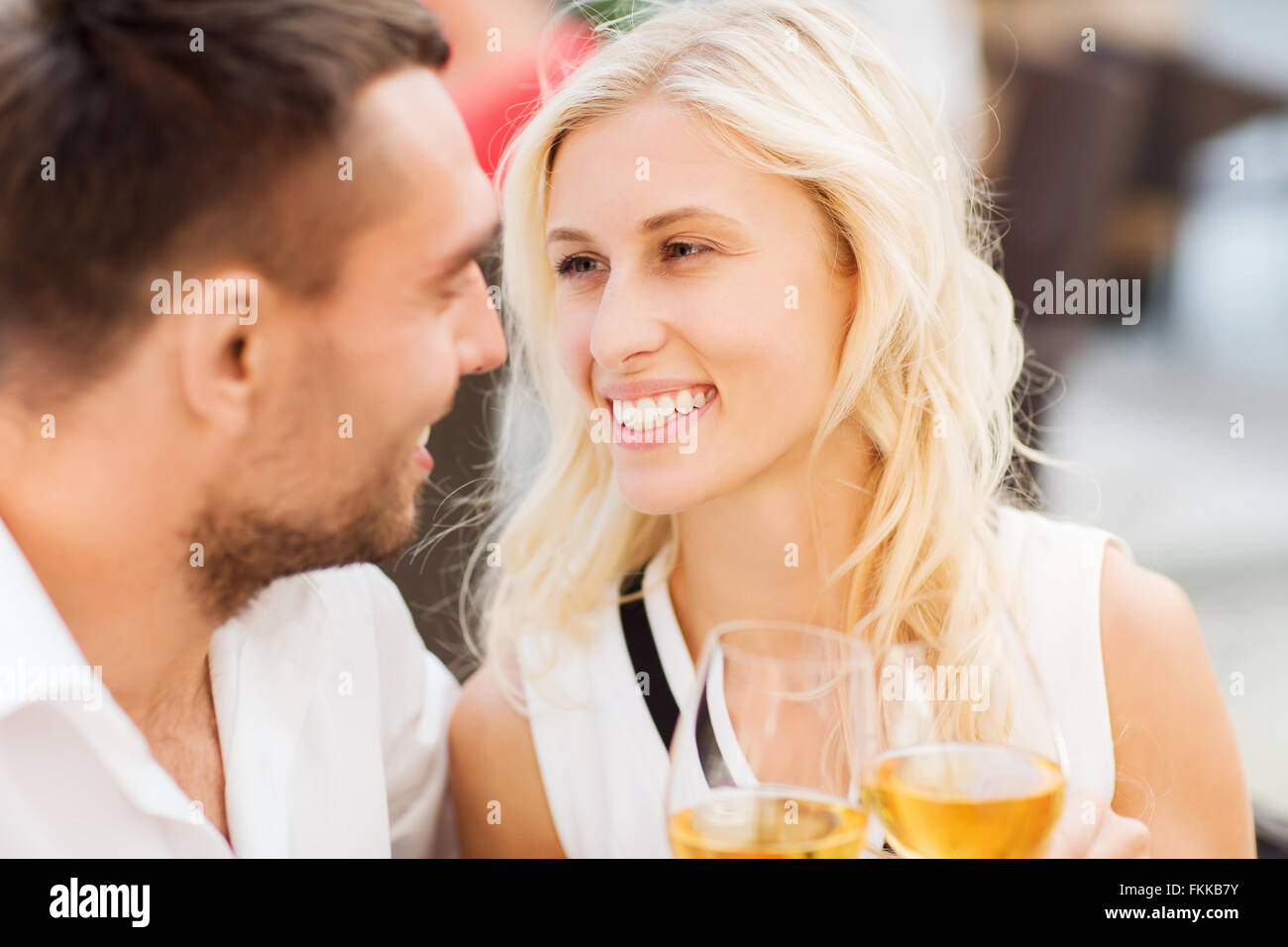 happy couple clinking glasses at restaurant lounge Stock Photo Alamy