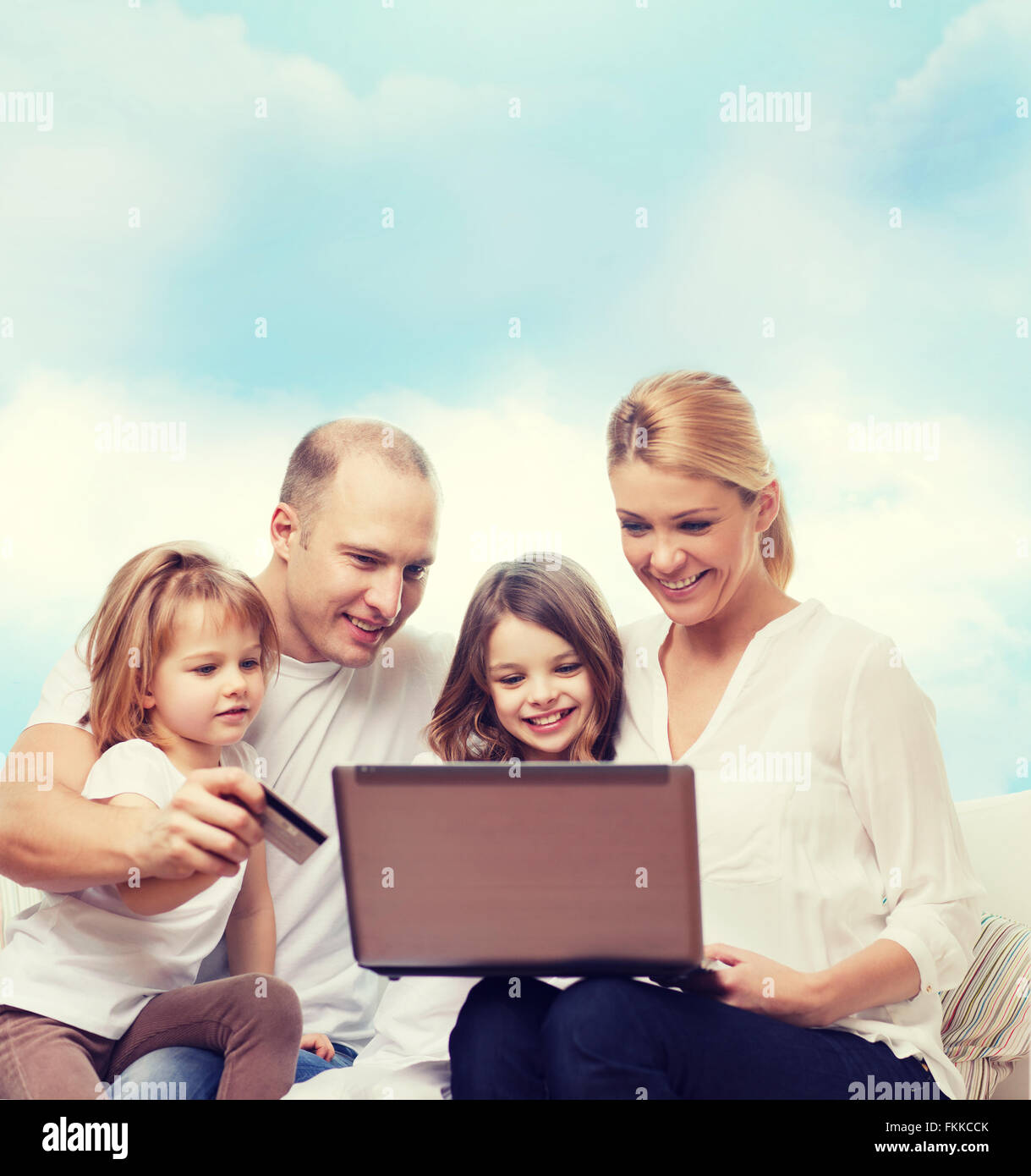happy family with laptop computer and credit card Stock Photo - Alamy