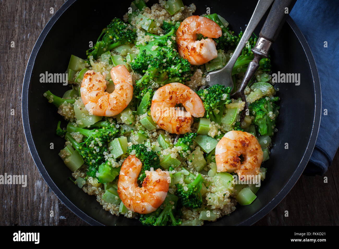 roasted garlic broccoli quinoa salad with prawns on pan Stock Photo Alamy