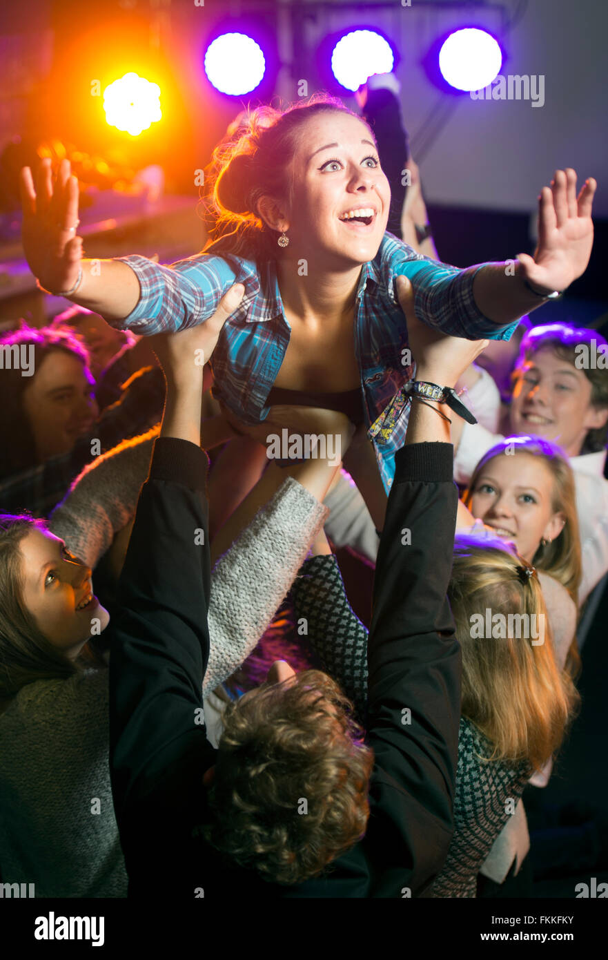 A seventeen year old girl is lifted up by fellow students during an ‘A’-Level Drama class UK Stock Photo
