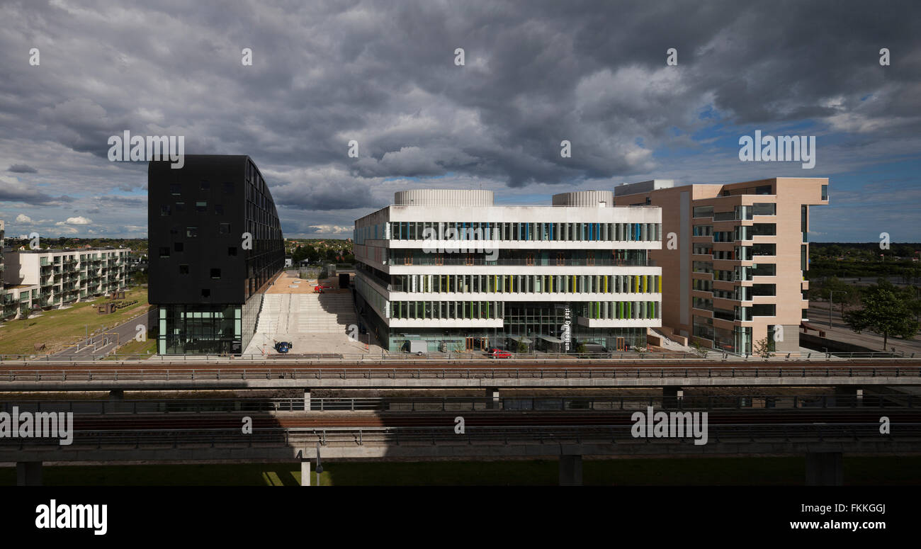 An exterior view of the Orestad College in Copenhagen, the dark sky can be seen in the distance. Stock Photo