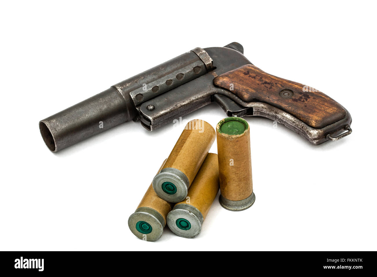 Old  signal pistol, flare gun and cartridges, isolated on white background Stock Photo