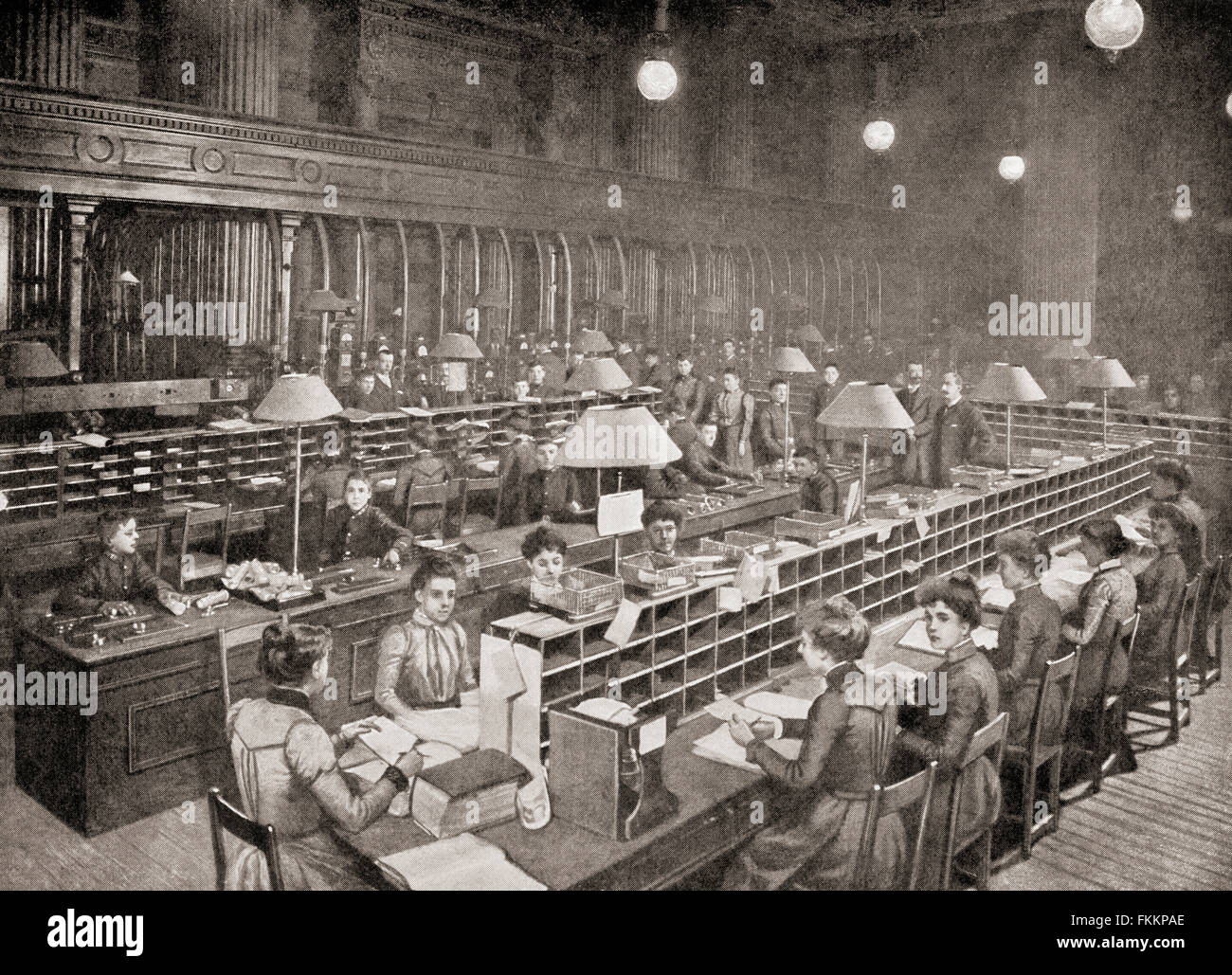 The pneumatic tube room in the The Central Telegraph Office, St Martin’s Le Grand, London, England in the late 19th century.  The room was  linked to almost all of the central London post offices by a pneumatic tube. By placing a telegram awaiting dispatch into a container, that resembled a 25lb shell case covered in felt-like material, it was possible to send the telegram via an underground tube direct to the CTO or the smaller tube officer located in the basement of King Edward Building, for dispatch. Stock Photo