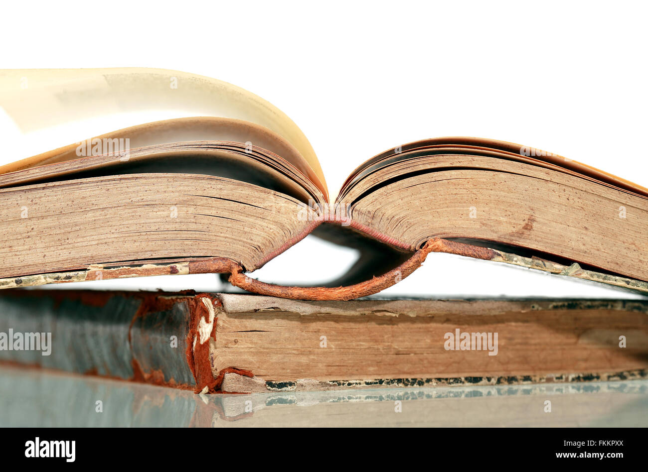 Closeup of old books on white background Stock Photo - Alamy