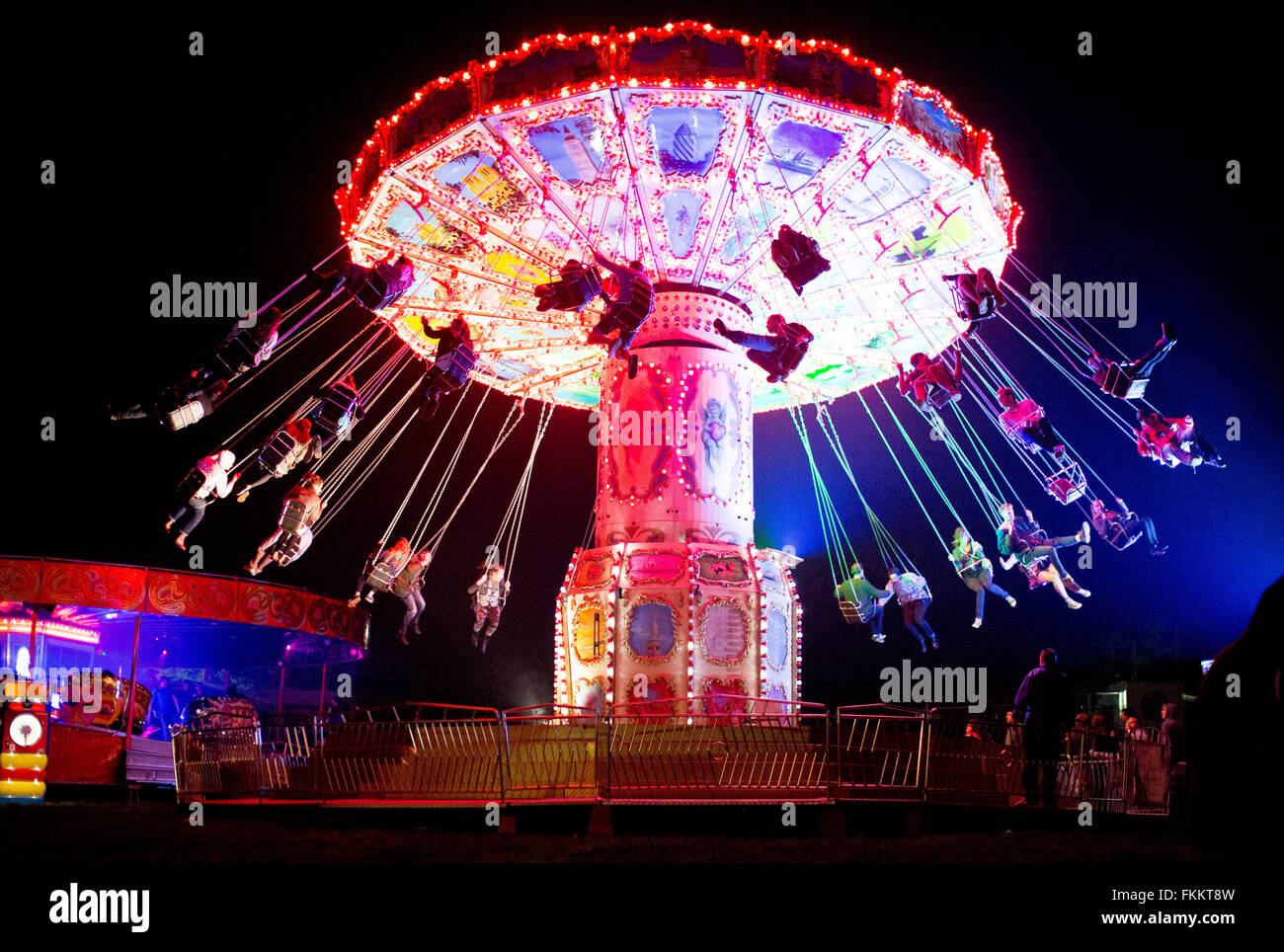 People ride on fairground rides at Brisfest, Ashton Court Estate, Bristol. 22 September 2012. Stock Photo